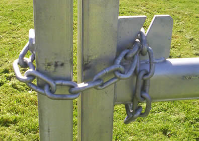 Two fence panel are locked by chain lock and details